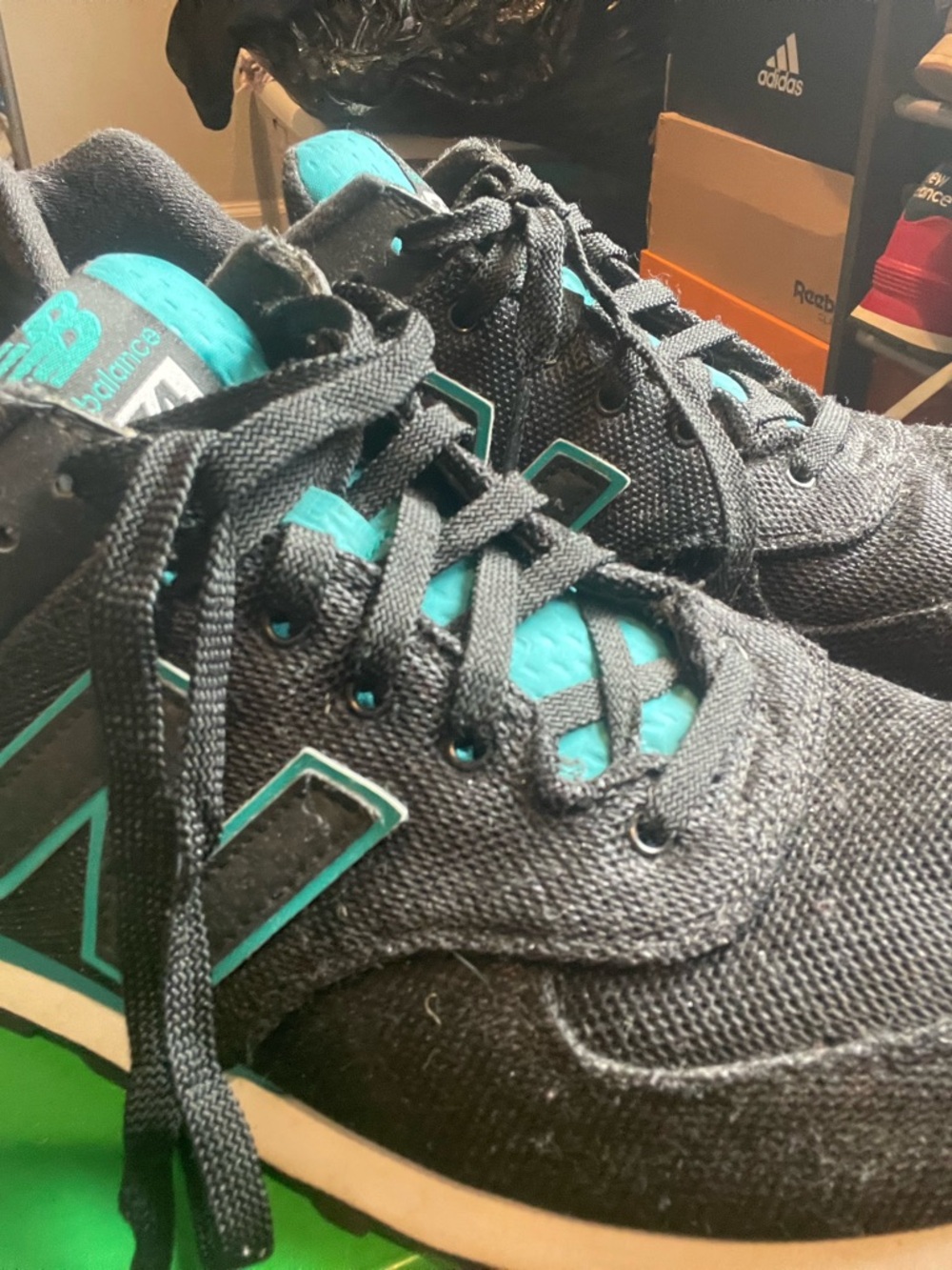 New Balance Men’s Black Sneakers with Teal Accents